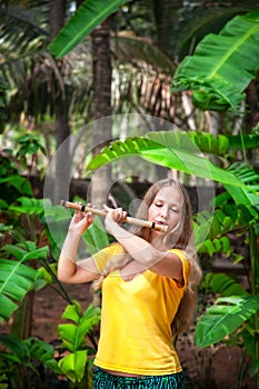 Girl playing the bamboo flute