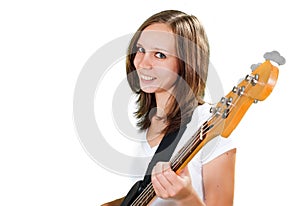 Girl playing bass guitar isolated on white