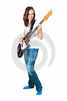 Girl playing bass guitar isolated on white