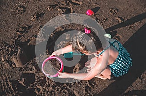 Girl playing at the beach