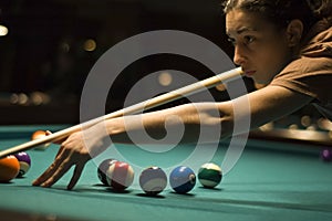 Girl playing billiard