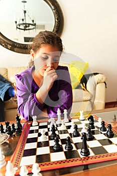 Girl playing chess