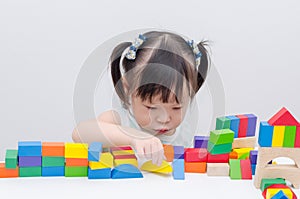 Girl playing colorful wood blocks