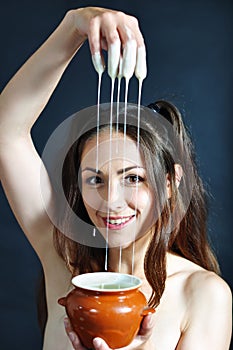 Girl playing with condensed milk