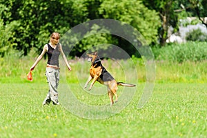 Girl playing with dog