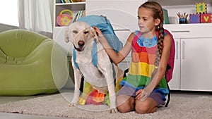 Girl playing with dog - with schoolbags on their backs