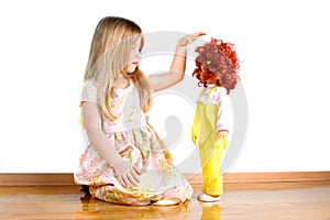 Girl playing with doll