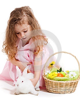 Girl playing with Easter bunny