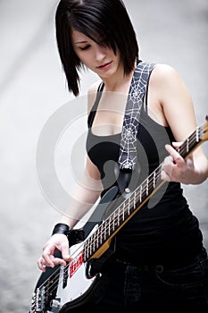 Girl playing electric bass