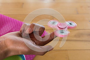 Girl playing with fidget spinner