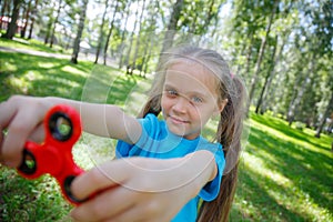 Girl playing with a fidget spinner