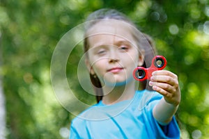 Girl playing with a fidget spinner