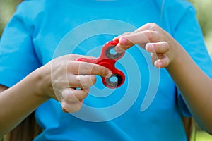 Girl playing with a fidget spinner