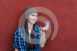 Girl playing with fidget spinner