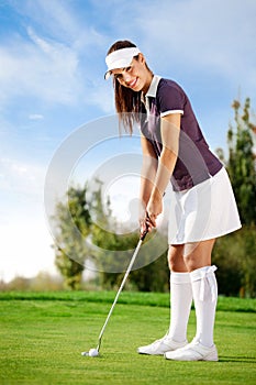 Girl playing golf