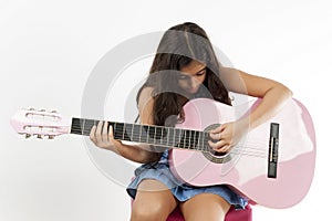 Girl playing guitar and sing