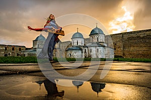 Girl playing the gusli in Church of St. Nicholas in Ivangorod Fortress