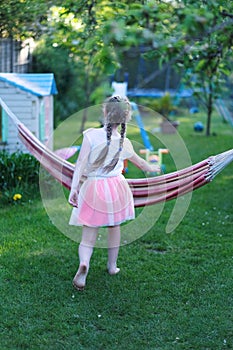 Girl playing with a hammock