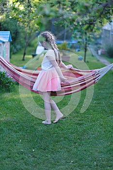 Girl playing with a hammock