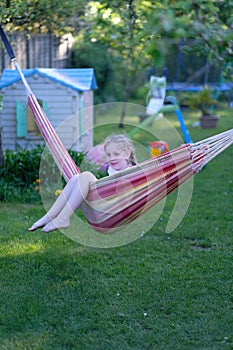 Girl playing with a hammock