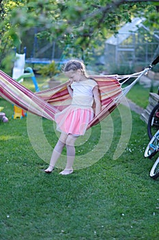 Girl playing with a hammock