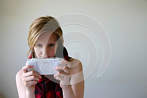 Girl playing handheld game console