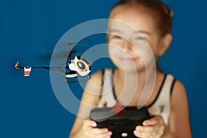 Girl playing with helicopter toy