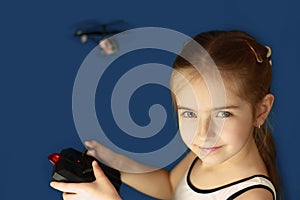 Girl playing with helicopter toy