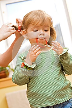 Girl playing during her morning beauty routine