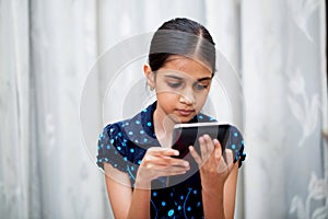 Girl playing with her tab