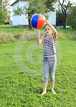 Girl playing inflating ball
