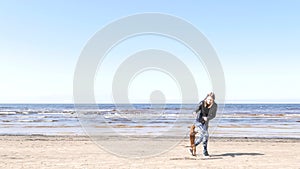 Girl playing with little doggy