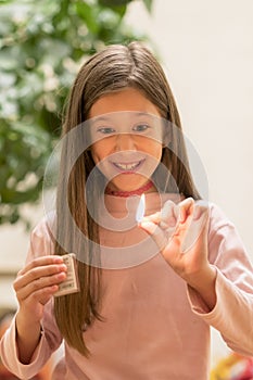 Girl playing with matches. Dangerous situation at home. A small child plays with matches, a fire, a fire flares up, danger, child