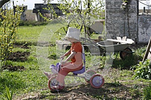 Girl playing old bucket helmet