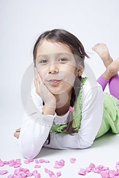 Girl playing with pink grit