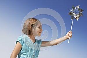 Girl Playing With Pinwheel Toy