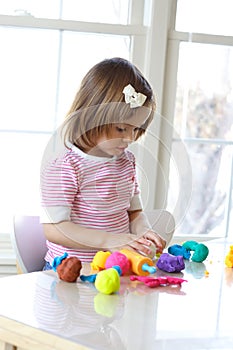 Girl playing with play dough