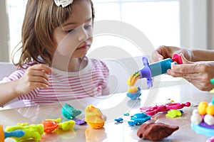 Girl playing with play dough