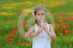 Girl playing the recorder