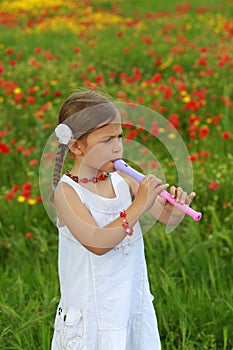 Girl playing a recorder (flute)
