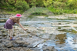 Girl Playing by River