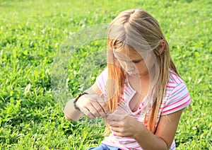 Girl playing with rubber bands