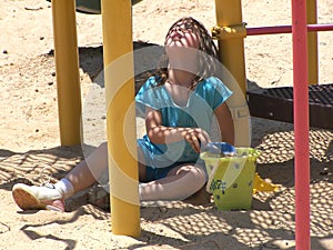 Girl playing in the sand