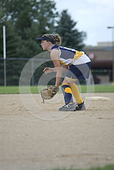 Girl Playing Second Base on Softball Field