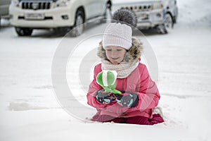 Girl playing with snow