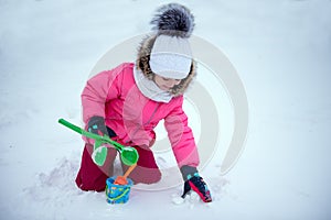 Girl playing with snow