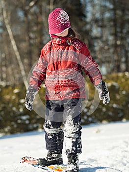 Girl playing in the snow