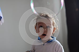 Girl playing with soap bubbles