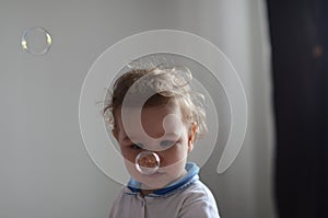 Girl playing with soap bubbles