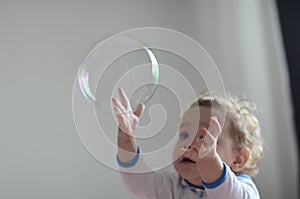 Girl playing with soap bubbles